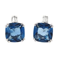 Pair of 9ct white gold cushion cut London blue topaz and tapered baguette cut diamond stud earrings, stamped 375