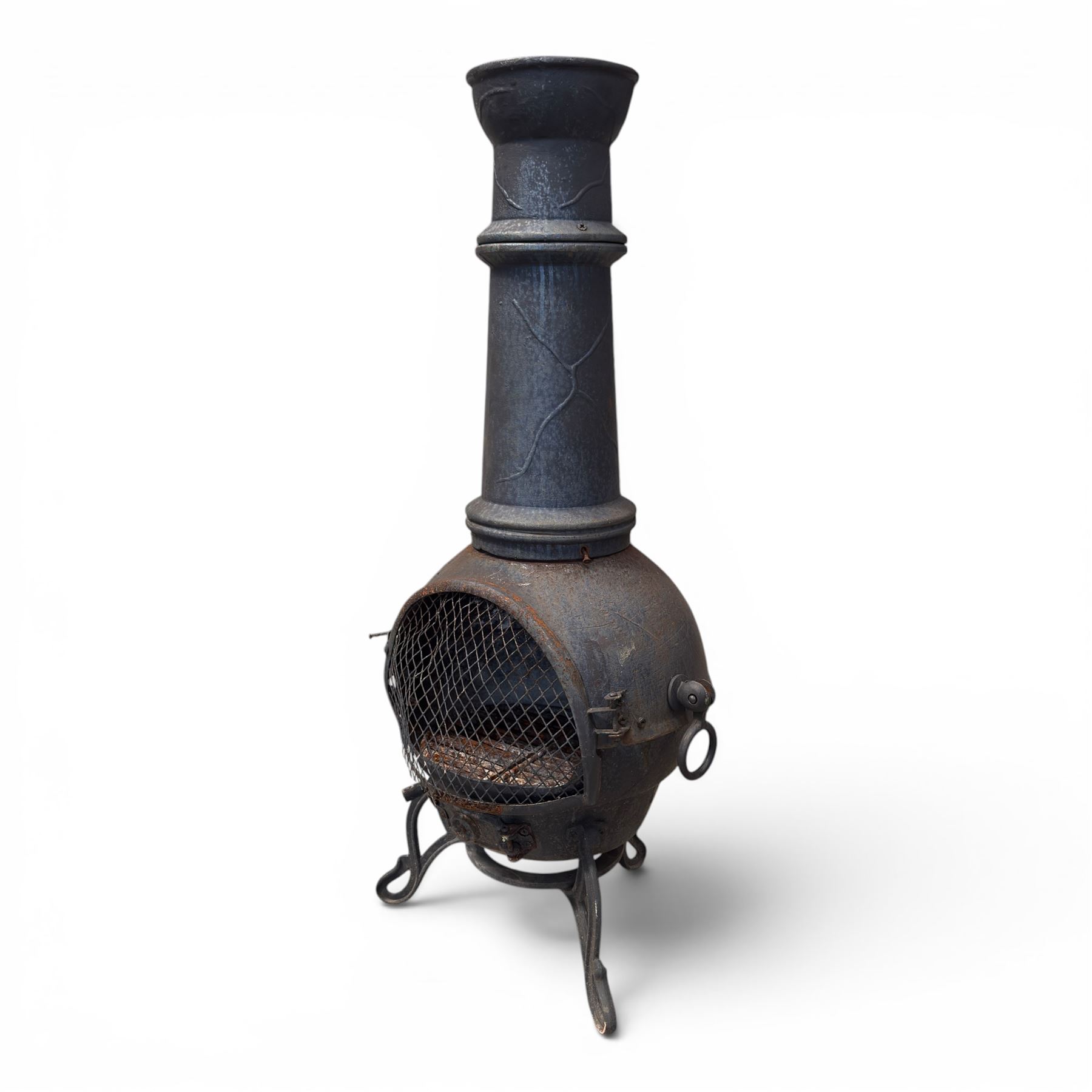 Cast iron garden chiminea, with mesh front spark guard, flue chimney on three splayed legs, finished in black.