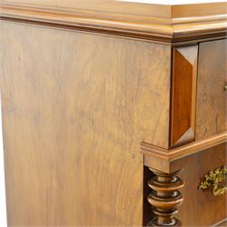 Tall late 19th century walnut chest, stepped and moulded top over six drawers, ornate cast gilt metal handles, enclosed by turned and fluted upright columns, on turned front feet 