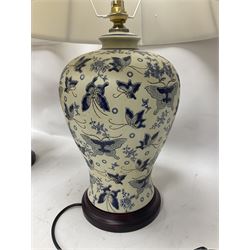 Pair of table lamps of baluster form, decorated in a butterfly motif with a cream group, upon a circular base, including shade H60cm