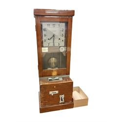 Early 20th Century Time Recorders Leeds Ltd mahogany cased clocking in machine, the square silvered dial with Arabic numerals above clocking in mechanism on plinth base, with a collection of blank clocking in cards, case H98cm