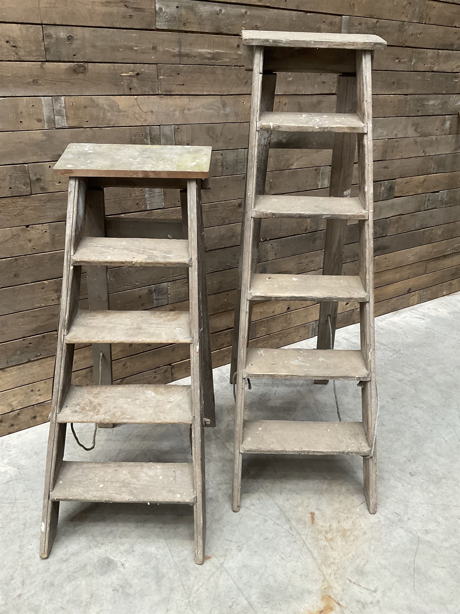 Two antique wooden step ladders, H100cm and 140cm