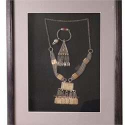 Framed Omani silver Hirz necklace, together with matching pendent, with filigree detail, together with another framed silver necklace 