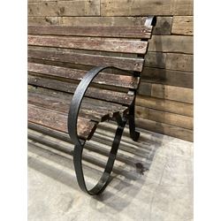 Early 20th century black painted wrought iron and wood slatted garden bench