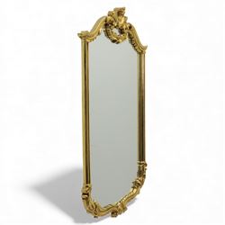 Late 20th century giltwood pier glass in a Rococo style, with rectangular mirror plate bor...