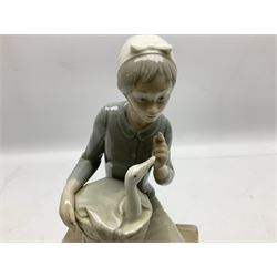 Lladro figures, Girl with Doll, no 1083, together with two Nao figures, and another similar