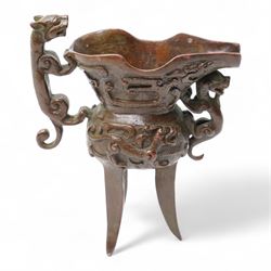 Chinese bronze libation cup with Zoomorphic handle on a tripod base H13cm