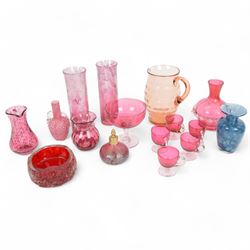 Collection of 19th century and later coloured glass, including pair of pink mottled lustre vases, orange jug with dimpled decoration, cranberry glass, etc 