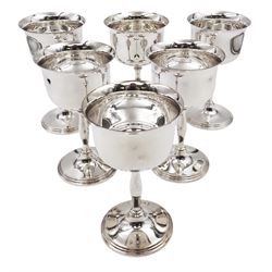 Set of six modern silver wine goblets, the bowls of plain cylindrical form with fluted rim, upon slightly waisted stem and stepped circular foot, hallmarked 	Frank Hawker Ltd, Birmingham 1973, H13.7cm
