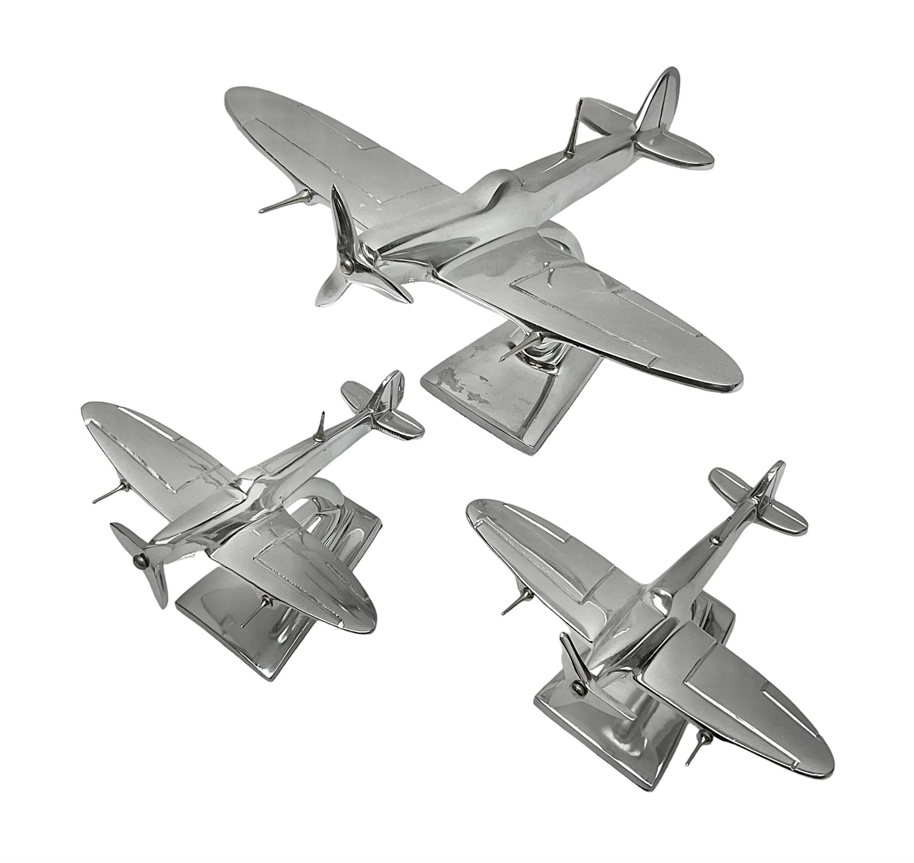 Set of three aluminium planes with rotating propellers, tallest H18cm