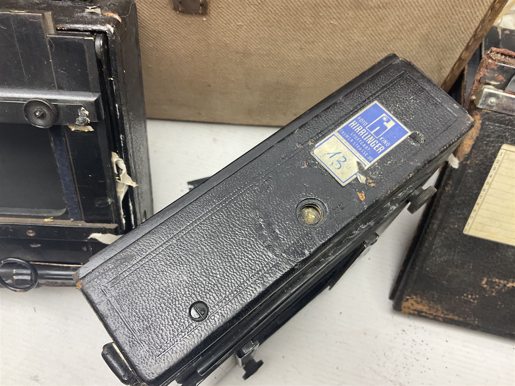 Contessa-Camera Werke folding camera, together with Hirrlinger folding camera, additional plates, two tripods and other accessories 