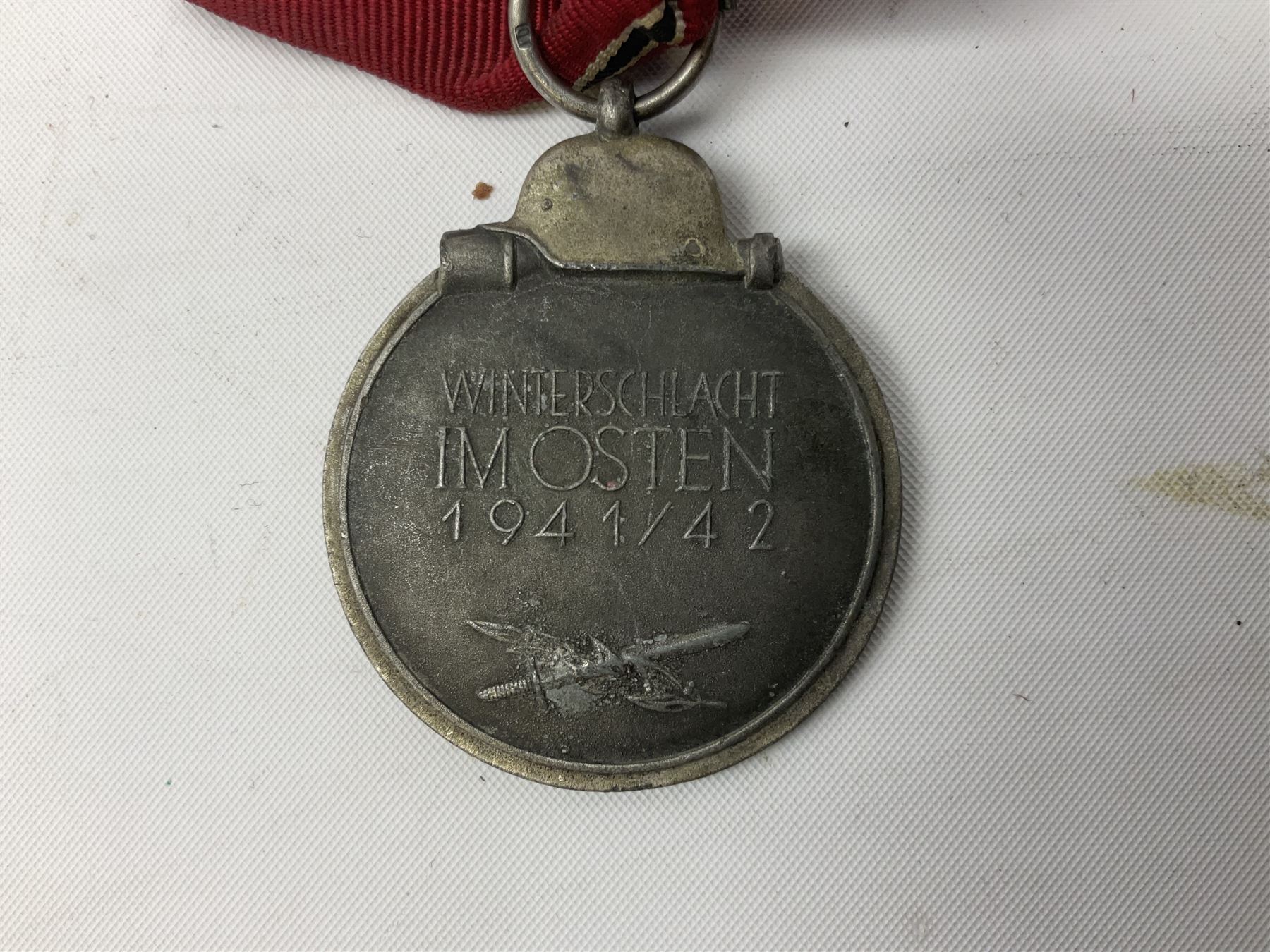 WW2 German Eastern Front Medal awarded to those who served on the German Eastern/Russian Front during the Winter Campaign period of 15th November 1941 to 15th April 1942 with original ribbon; and German War Merit Cross with swords 2nd Class (2)