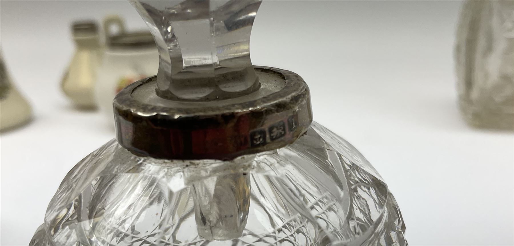 Group of silver mounted glass scent bottles and crested ware, together with a Brierglass lead crystal box with a glass and silver, lid, etc all silver with various hallmarks. 