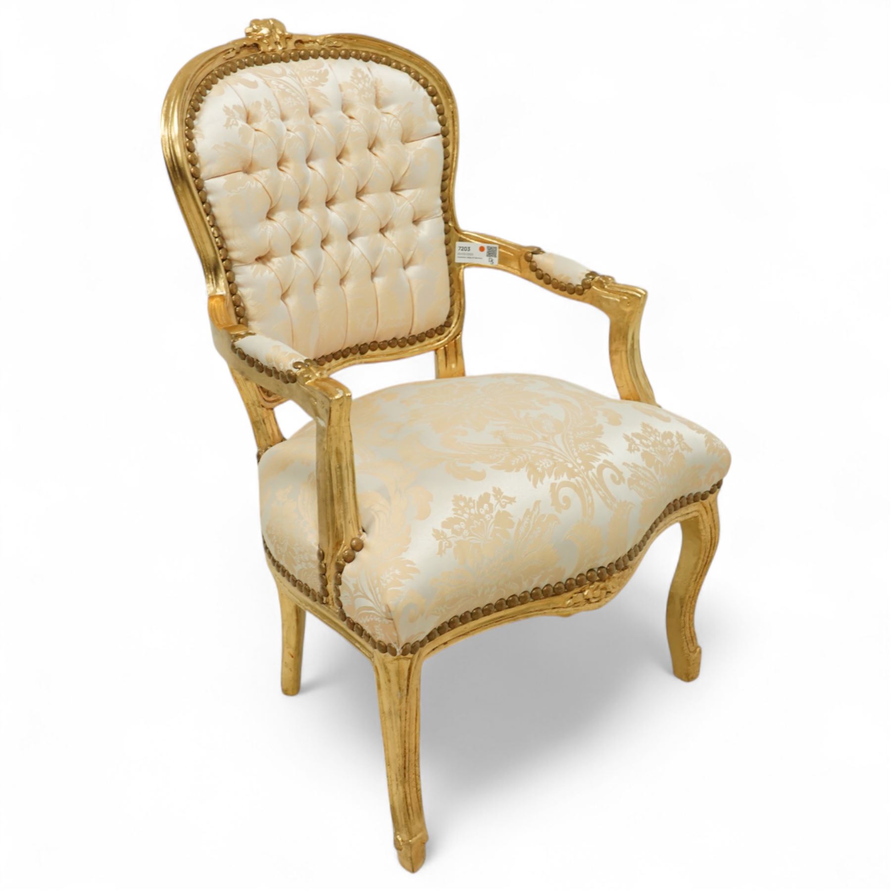 French design gold painted framed armchair, serpentine front with cream damask upholstery, padded arms with studded border  