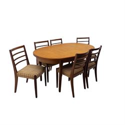 Mid-20th century teak oval extending dining table with set of six teak ladder back chairs with upholstered seats, table W150xD91xH74cm, 199cm extended, chairs W41xD43xH94cm