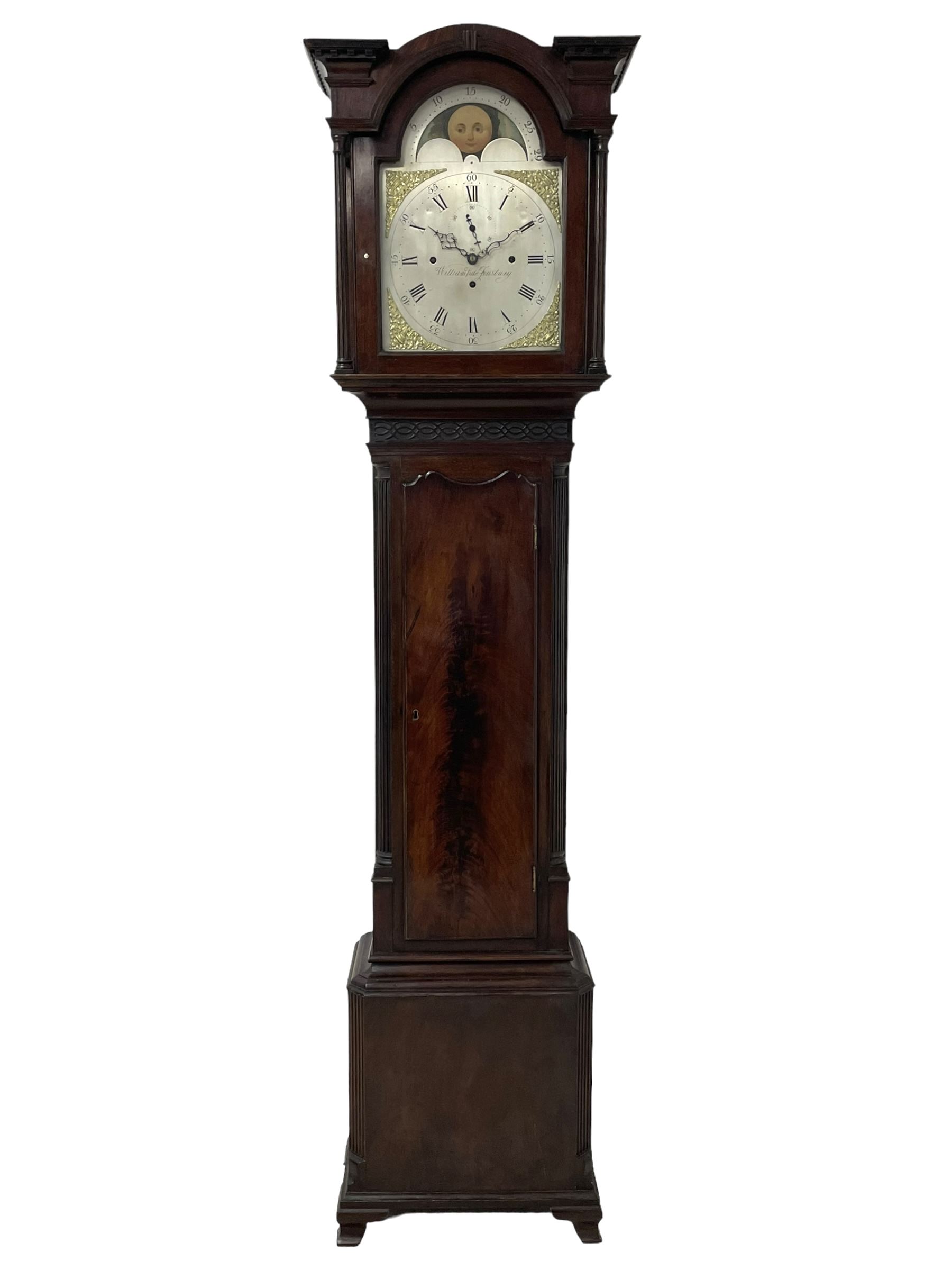 William Vale of Finsbury (London) - late 18th century 8-day mahogany longcase clock, flat topped break-front hood with a break-arch hood door, detached reeded pilasters with wooden capitals, trunk with a blind fret, stopped reeded quarter columns and a long wavy topped door, on a square plinth with canted corners and bracket feet, engraved silver sheet dial with cast brass spandrels, matching steel hands and rolling moon to the arch, with an engraved seconds dial, Roman numerals, five minute Arabics, minute markers and matching steel hands, three train, quarter chiming  movement on six bells with a recoil anchor escapement. With pendulum and weights.

This item has been registered for sale under Section 10 of the APHA Ivory Act