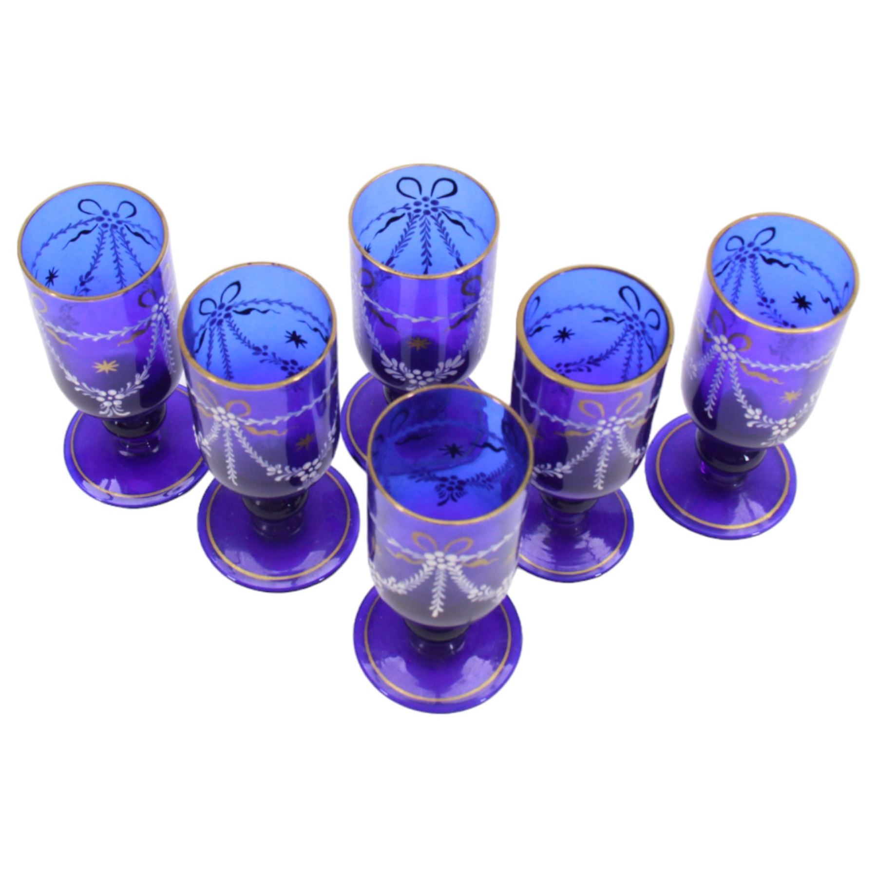 19th century style blue glass decanter and six drinking glasses, the decanter of mallet form with lozenge shaped stopper, all with white enamel and gilt swag decoration, decanter H34cm, drinking glasses H11.5cm