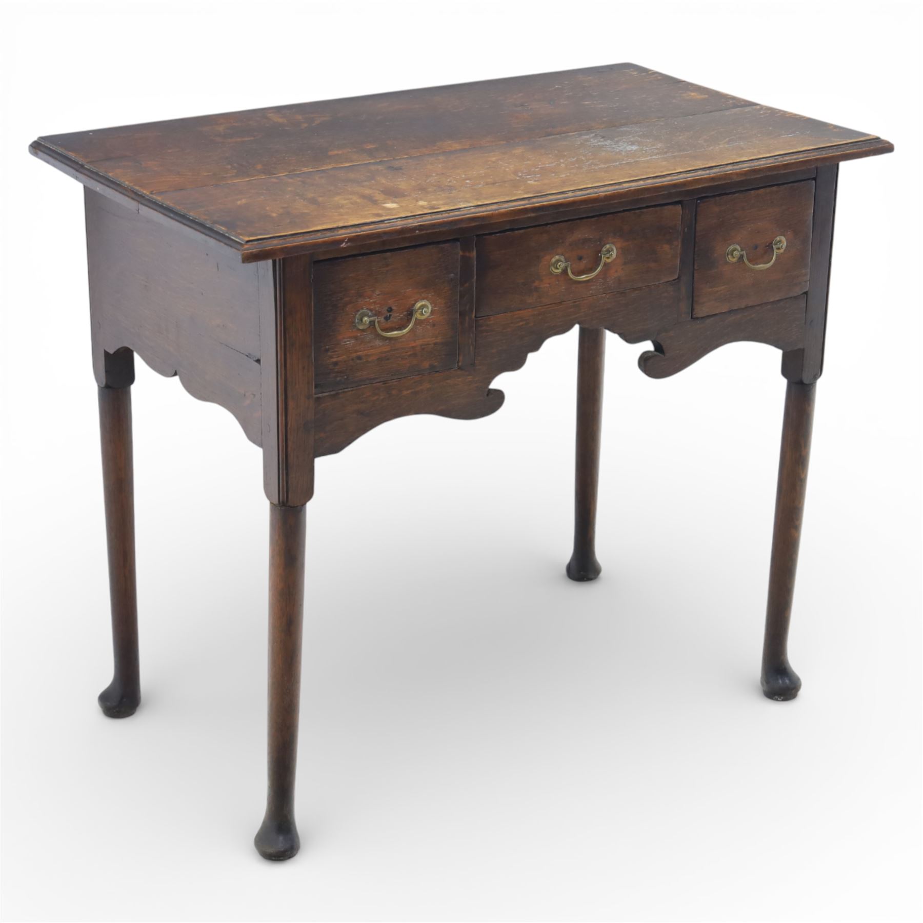 Georgian oak lowboy, the rectangular top with moulded edge over three fitted drawers and shaped apron, raised upon slender cabriole legs, with pad feet