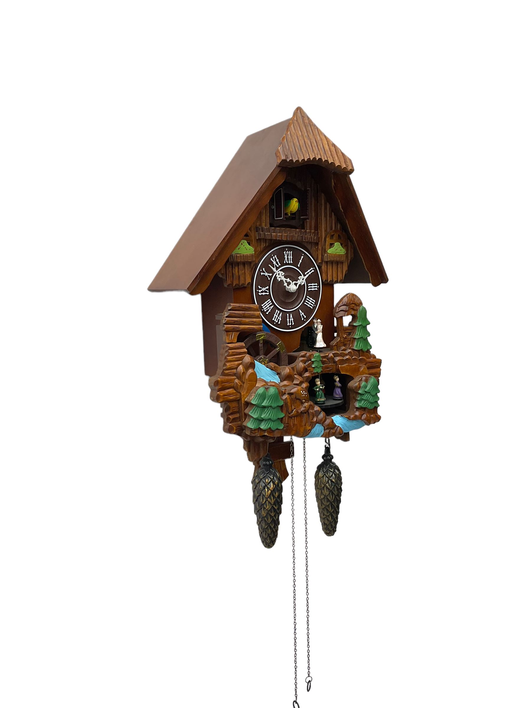 Battery operated cuckoo clock in a traditional chalet styled case with