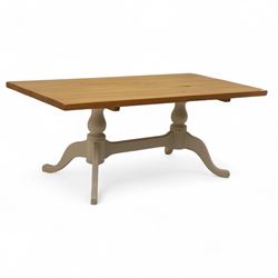 Contemporary light oak dining table, painted tripod bases with stretcher 