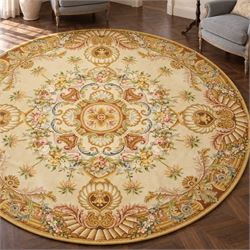 20th century French Aubusson style circular carpet, cream ground of Savonnerie design with...