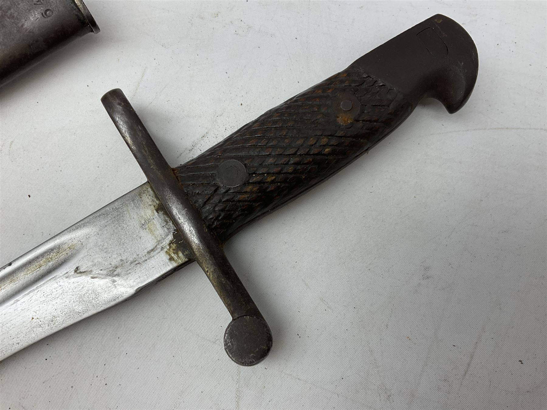 Austrian Model 1895 carbine NCO's knife bayonet with 25cm fullered steel blade; in steel scabbard with webbing frog L39cm overall; and Spanish Model 1941 Bolo bayonet with 25cm fullered steel blade No.6412D; in steel scabbard (2)