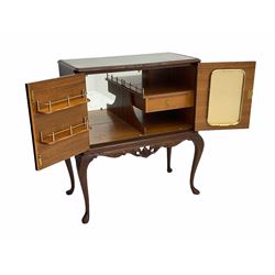 Mid 20th century mahogany cocktail cabinet, with fitted interior, on cabriole supports 