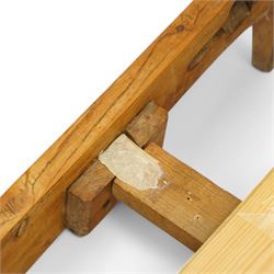 Mid-20th century French walnut small double 4' 2'' bedstead, shaped and moulded headboard with shell and curl acanthus leaf carved pediment with extending flower heads, quarter-matched veneers decorated with applied mouldings and cast gilt metal ribbon tie 