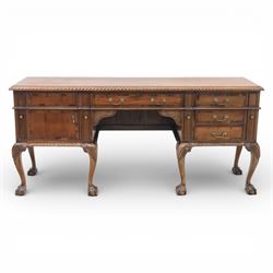 Georgian design mahogany sideboard, the rectangular top with moulded gadrooned edge, fitted with a central frieze drawer flanked by cupboard doors, raised upon cabriole legs terminating in ball and claw feet
