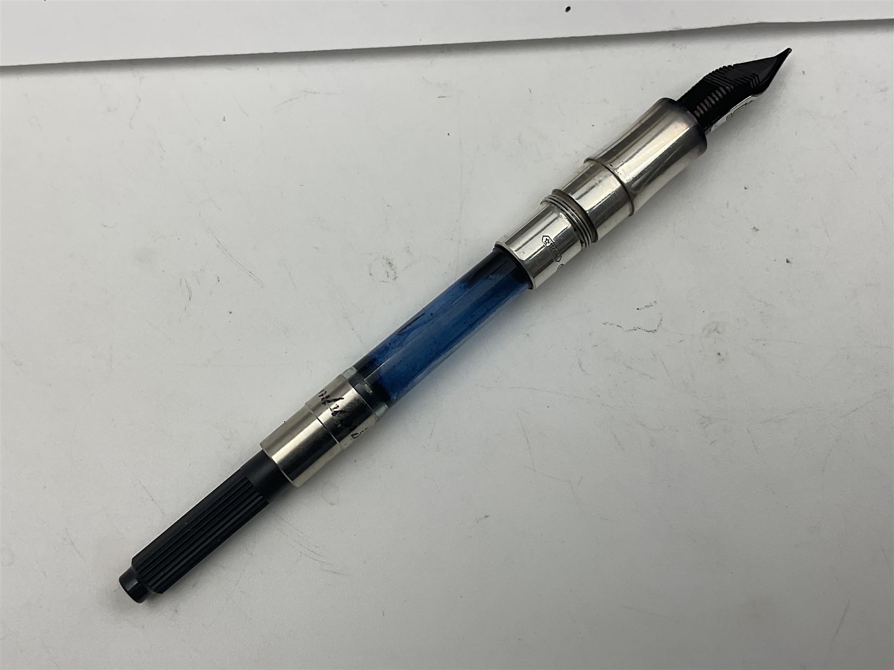 Montegrappa Emblema fountain pen, the blue pearl marbled barrel of octagonal form with silver mounts stamped 925 and silver mounted cap with 1912 emblem and clip with roller, in box, L13.5cm