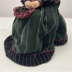 Anna Meszaros Hungary - hand made needlework finely detailed figurine of a pensive old lady seated on a stool wearing a lace trimmed long black and maroon dress and hat, clutching a lace bag H32cm Auctioneer's Note: Anna Meszaros came to England from her native Hungary in 1959 to marry an English businessman she met while demonstrating her art at the 1958 Brussels Exhibition. Shortly before she left for England she was awarded the title of Folk Artist Master by the Hungarian Government. Anna was a gifted painter of mainly portraits and sculptress before starting to make her figurines which are completely hand made and unique, each with a character and expression of its own. The hands, feet and face are sculptured by layering the material and pulling the features into place with needle and thread. She died in Hull in 1998.