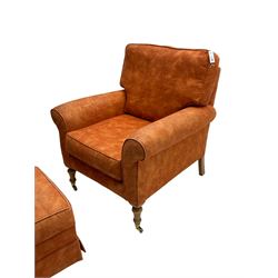 Pair traditional shape armchairs, upholstered in burnt orange fabric, on turned beech supports with brass castors (W85cm, H96cm, D92cm), together with matching footstool (54cm x 54cm, H37cm)