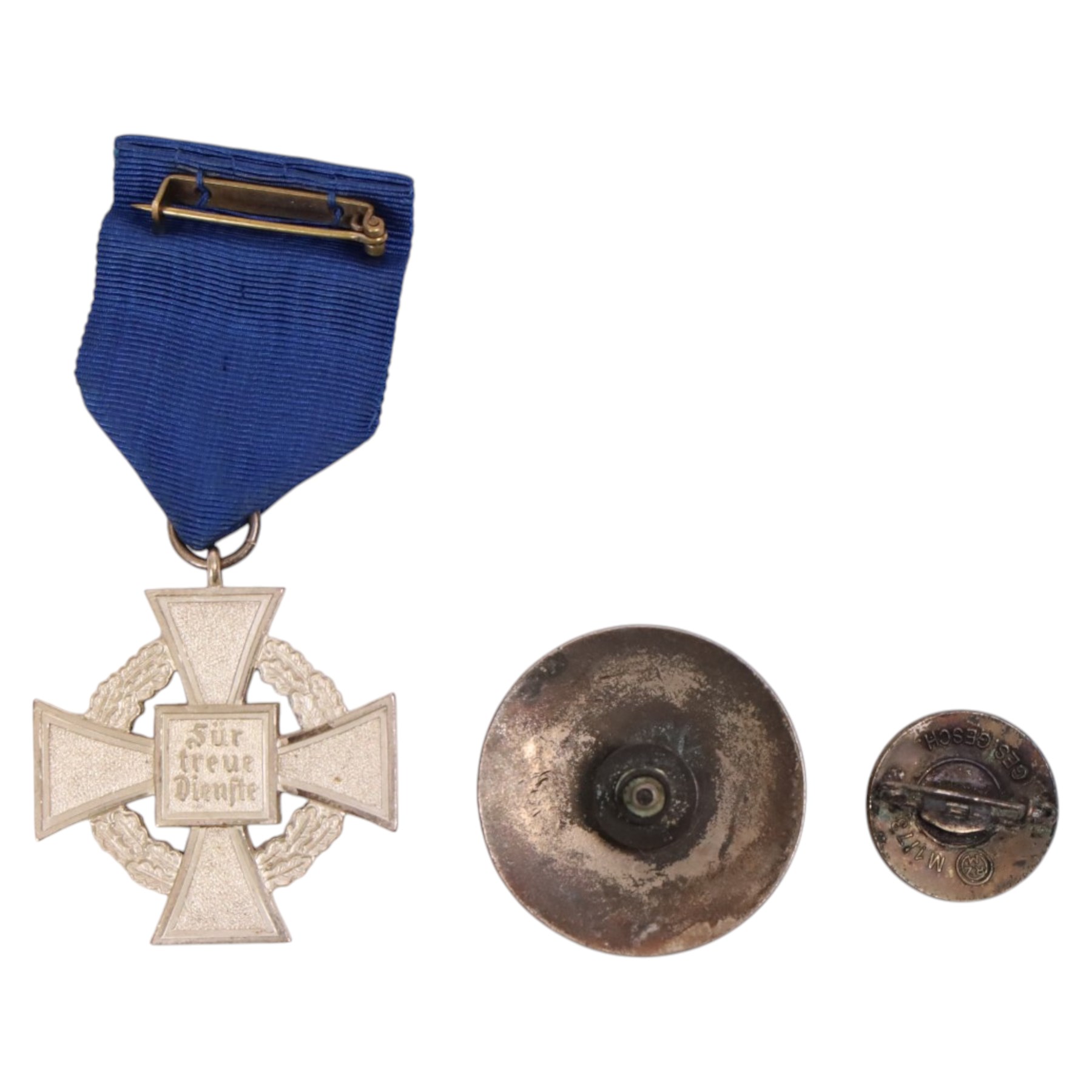 Third Reich NSDAP 25 Year Faithful Service Decoration, together with two NSDAP badges