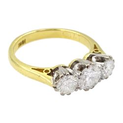 18ct gold three stone round brilliant cut diamond ring, stamped total diamond weight approx 0.95 carat 
