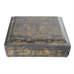 19th century Chinese export black lacquered games box, of rectangular form decorated to the exterior with figures, pagodas and bridges in a riverside landscape in red and gilt, the lift off cover opening to reveal a compartmented interior with four removable covered boxes decorated with conforming figural scenes, and eight trays decorated with stylised suits, H10cm W30cm D27cm