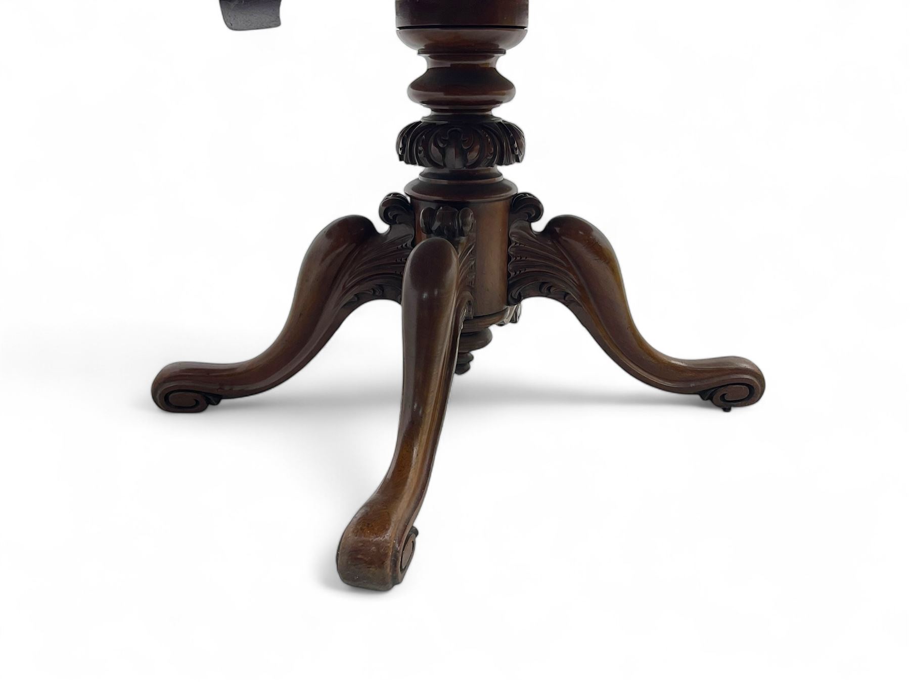 Victorian mahogany breakfast loo table, oval tilt-top on turned pedestal, quatrefoil out-splayed carved supports, scroll carved terminals with brass castors