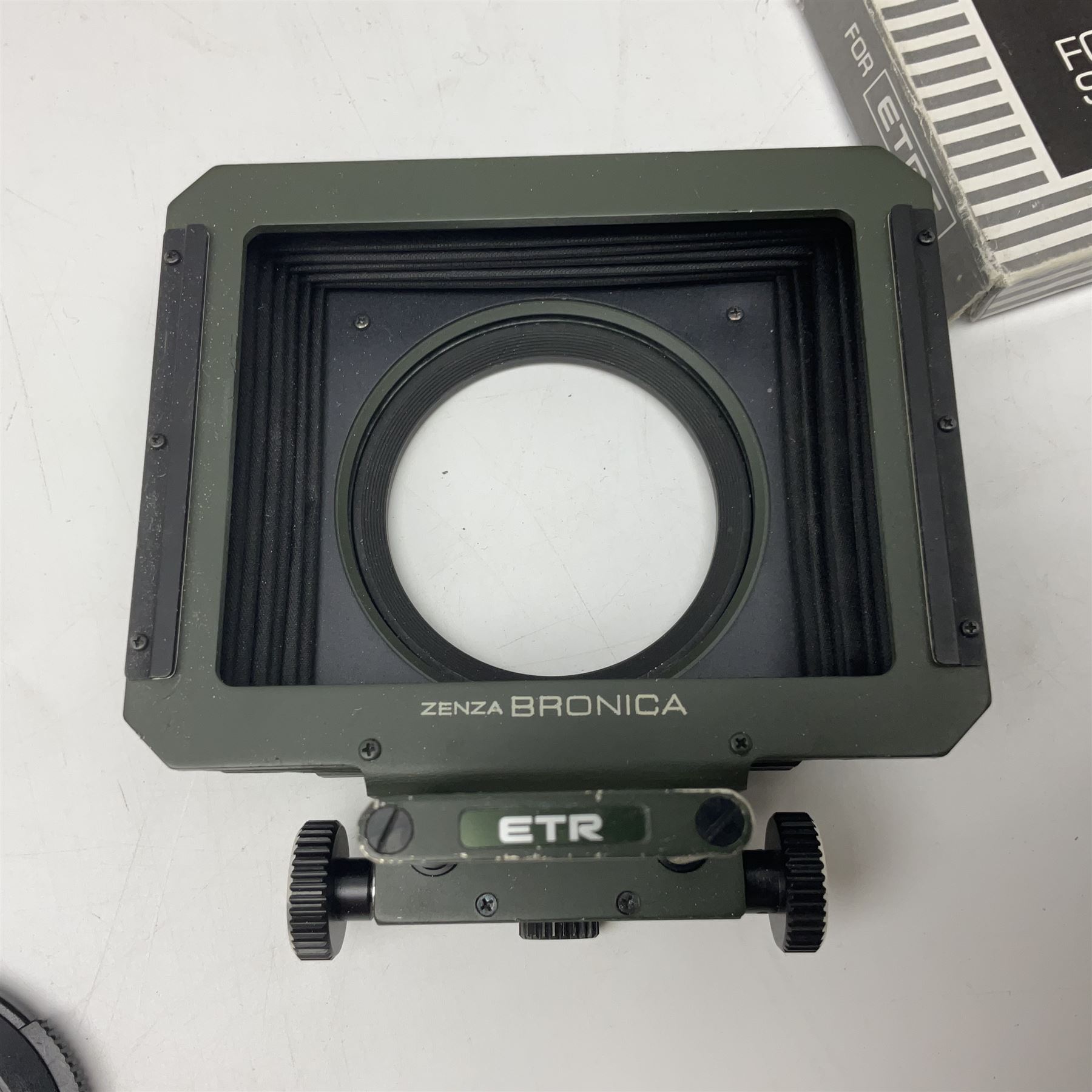 Zenza Bronica ETRS camera body, safari edition, serial no. 7100811, with 'Zenza Bronica Zenzanon EII 1:2.8 f=75mm' lens, serial no. 7908591, film magazine back, safari, serial no. 8100564, AE-ii metering head, safari, serial no. 617024, etc, all in leather case