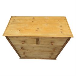 Victorian polished pine chest, straight front with panelled sides, fitted with two short and three long drawers, turned wooden handles