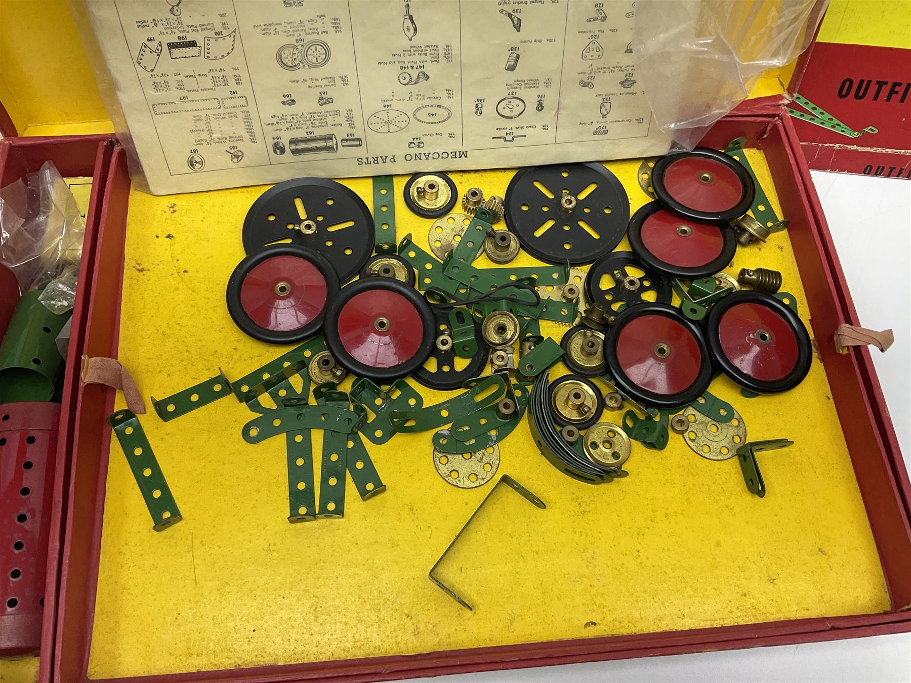 Meccano - Outfits 4, 6 & 7 with red and green parts; Outfits 4 & 6 virtually fully stocked and Outfit 7 containing large quantity of loose parts; Outfits 4 & 7 with instruction manuals; all boxed (3)