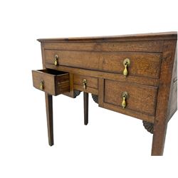18th century Welsh oak lowboy, fitted with long drawer above three small drawers, square tapering supports, with fan carved corner brackets, circular plate and drop handles 