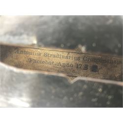 German violin c1890 with 36cm two-piece maple back and ribs and spruce top; bears label 'Antonius Stradivarius Cremona Faciebat Anno 1729' L59.5cm overall; in ebonised wooden 'coffin' case; and two German violins c1890 for completion - one bearing a Stradivarius label, the other a Ruggeri label; both in carrying cases (3)