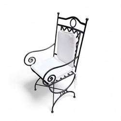 Wrought steel rectangular conservatory dining table, with glass top; and six, four side and two armchairs, with lattice backs and X framed bases, loose cushions