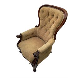 Victorian mahogany upholstered armchair, moulded framed, scroll carved arm terminals on scrolled cabriole supports, shaped carved apron