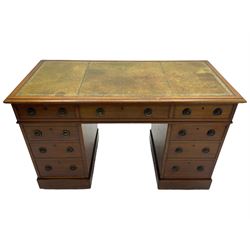 Howard & Sons. - 19th century walnut twin pedestal desk, moulded rectangular top with tooled leather inset, fitted with nine drawers with circular pressed brass handle plates decorated with urns, each drawer fitted with a 'Hobbs, London' lock, on plinth base, the upper right-hand drawer stamped 'Howard & Sons, Berners St.' and with paper label
