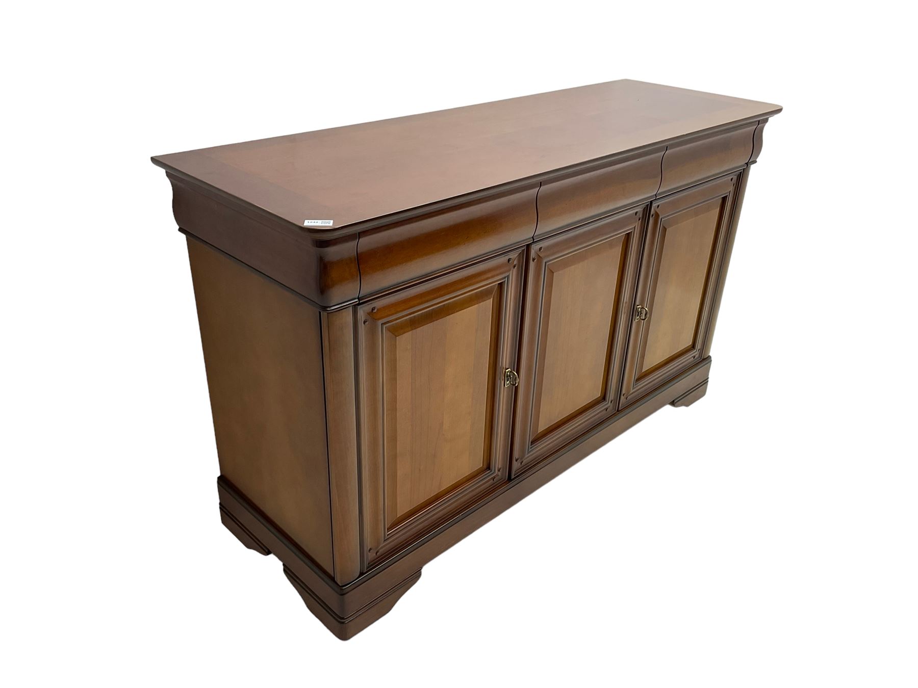 Cherry wood sideboard, fitted with three cushion drawers over three panelled cupboard doors, on bracket feet