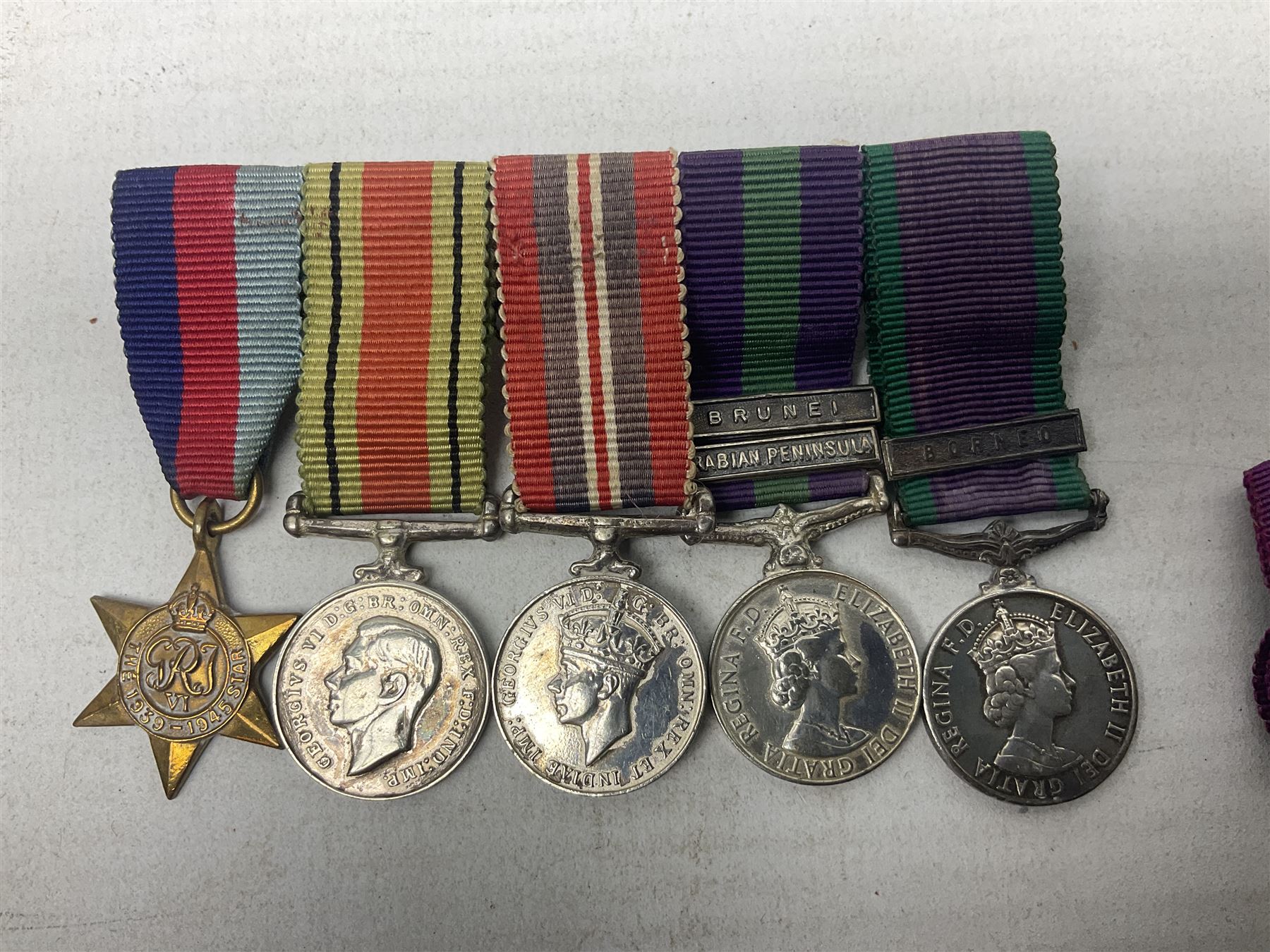 Three miniature groups of five medals - OBE Military group with WW1 trio and Italy Order of Saints Maurice & Lazarus Knights Cross; MBE Military group with WW2 trio and Territorial Efficiency Decoration; and WW2 trio, General Service Medal 1918-62 with Brunei and Arabian Peninsula clasps and GSM 1962 with Borneo clasp; all with ribbons on pinned wearing bars (3)