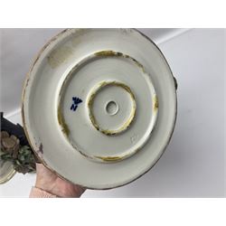 Three Capodimonte figures, to include The Kind Heart Man, modelled by Cortese as a tramp with two doves, The Young Falconer by Maria Angela and another modelled as a tramp darning his socks, all with printed marks, tallest H39cm