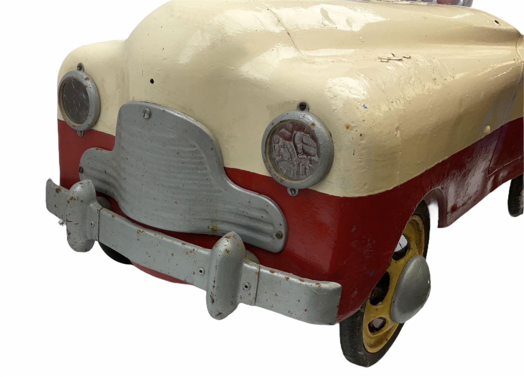 1950s child's tin-plate pedal car, possibly by Tri-ang, painted white and red and named 'Crusader' L104cm