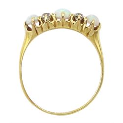 Early 20th century 18ct gold three stone opal, the centre stone set with two old cut diamonds either side, London 1913, total diamond weight approx 0.30 carat