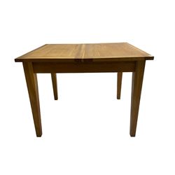 Light oak extending dining table, pull-out action with fold-out leaf, on square tapering supports